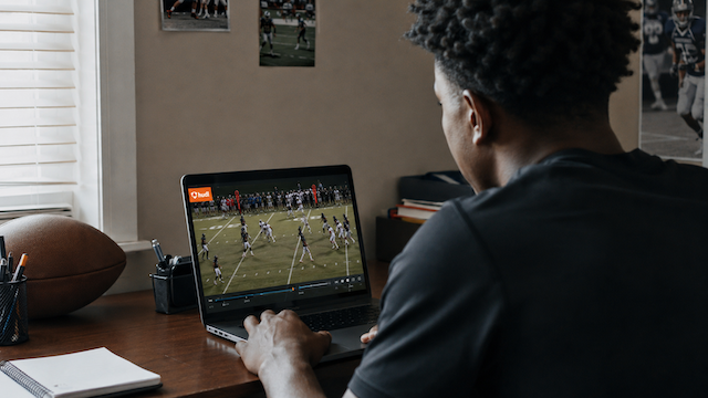 High school defensive back reviewing his Hudl highlight film for college recruiting
